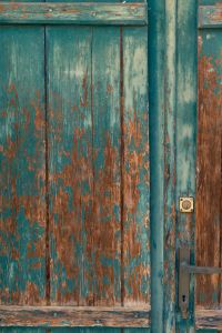 Kaboompics - Distressed Turquoise Double Door with Peeling Paint Layers