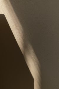 Warm Beige Backgrounds with Sunlight and Geometric Shadows