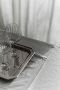 Kaboompics - Two Wine Glasses on Reflective Silver Tray