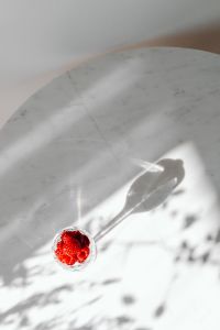 Kaboompics - Overhead Raspberry Filled Glass With Long Shadow
