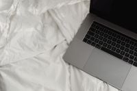 Kaboompics - Laptop on White Sheets in a Minimal Home Office Setup