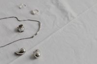 Kaboompics - Silver Jewelry Flat Lay with Rings and Earrings
