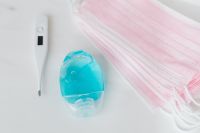 Kaboompics - Close-Up Flat Lay of Sanitizer, Masks and Thermometer