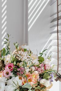 Kaboompics - Vertical Floral Bouquet with Window-Blind Shadows and Bright Copy Space