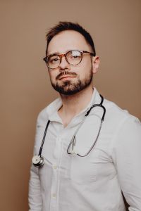 Kaboompics - Male Doctor with Glasses and Stethoscope, Slightly Turned Neutral Portrait for Healthcare Branding