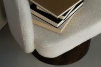 Kaboompics - Cozy Reading Nook with Books on Bouclé Lounge Chair