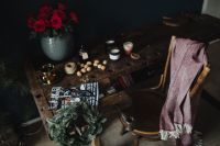 Kaboompics - New Yorker, some nuts, watches, and other things on the old, wooden table, wreath