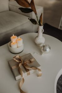 Kaboompics - Gift Wrapping on a Coffee Table with Candles and Vase