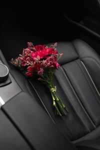 Kaboompics - Autumn Flower Bouquet on a Black Leather Car Seat