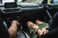 Kaboompics - Couple on a Road Trip Seen from the Passenger Seat