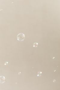 Kaboompics - Minimal Soap Bubbles on a Beige Background with Ample Copy Space