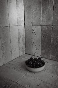 Kaboompics - Dark Cherries in a Stone Bowl with Soft Shadows