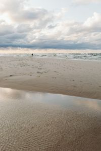 Kaboompics - Cloudy Baltic Beach with Rippling Sand and Wet Shoreline, Vertical Coastal Background