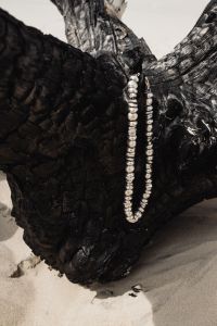 Kaboompics - Beaded Silver Necklace on Black Driftwood