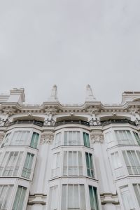 Kaboompics - Madrid White Facade Cornice and Balconies Beneath an Expansive Cloudy Sky