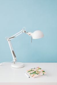Kaboompics - White Adjustable Desk Lamp Against a Pale Blue Wall