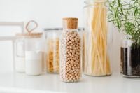 Kaboompics - Reusable Glass Jars of Chickpeas, Spaghetti, Farfalle and Flour for Pantry Storage