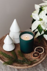 Kaboompics - Close Up of Green Candle, Paper Trees and Dried Oranges