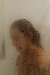 Kaboompics - Woman Showering Behind Condensation-Covered Glass