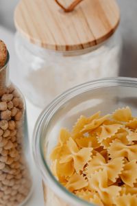 Kaboompics - Flour in a Wooden-Lidded Glass Jar beside Chickpeas and Bow-Tie Pasta