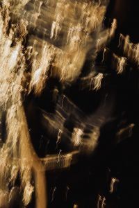 Kaboompics - Bright Gold Light Trails on Black, Vertical Abstract Wallpaper with Dramatic Contrast