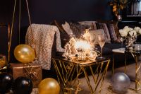 Kaboompics - Cozy New Year's Eve Living Room with Sparkler, Champagne, Balloons and Wrapped Gifts