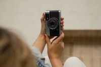 Kaboompics - Vintage Camera Held In Both Hands