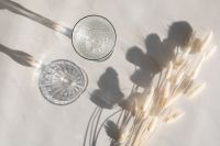 Kaboompics - Overhead Pair of Water Glasses and Dried Stems with Sunlit Shadows