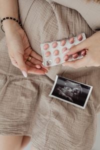 Kaboompics - Pills and Pregnancy Test on Beige Dress