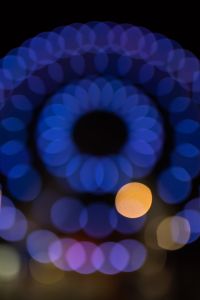 Kaboompics - Portrait Ferris Wheel with a Red Rim and Blue Spokes