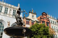 Kaboompics - Low-Angle Gdańsk Neptune Fountain with Artus Court and Colorful Old Town Facades
