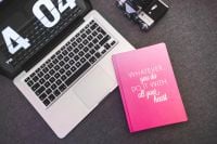 Kaboompics - Pink notebook with a silver laptop and a camera