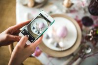 Kaboompics - Woman taking photo of easter eggs on a plate