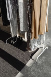 Kaboompics - Silver, Gold and Black Party Dresses on Clothing Rack