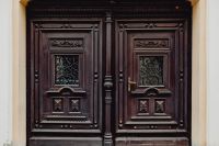 Kaboompics - Ornate Dark Wooden Door in Zamość Old Town