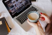 Kaboompics - Woman Taking a Coffee Break with MacBook and Notebook in a Relaxed Home Office