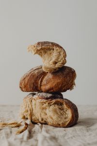 Kaboompics - Stack of Rustic Bread Loaves on Linen