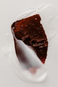 Kaboompics - Dark Brown Lip Gloss with Clear Gloss Texture