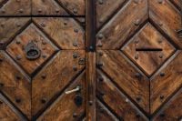 Kaboompics - Rustic Wooden Door Texture With Geometric Panels and Iron Studs