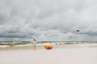 Kaboompics - Orange Boat by the Shore with Baltic Sea Waves