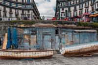 Kaboompics - Two Old Fishing Boats Beside a Naples Harbor Shed