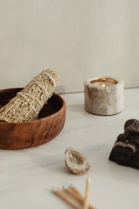 Kaboompics - Sage Bundle And Candle With Buddha In Soft Focus