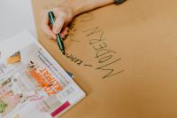 Kaboompics - Man hand holding a green marker pen