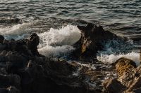 Kaboompics - Waves Breaking Between Dark Coastal Rocks