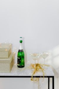 Kaboompics - White Champagne Display With Gift Boxes and Copy Space