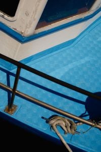 Kaboompics - Blue Boat Deck With Coiled Mooring Rope