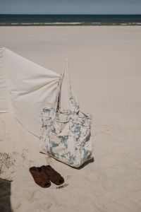 Kaboompics - Floral Beach Bag and Brown Sandals on the Shore