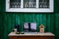 Kaboompics - Vintage Work Desk With Laptop, Coffee Pot and Birdhouse