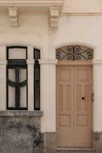 Kaboompics - Maltese Facade with Arched Iron Grille and Paneled Door