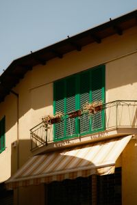 Kaboompics - Green Window Shutters and Striped Awning on an Italian House